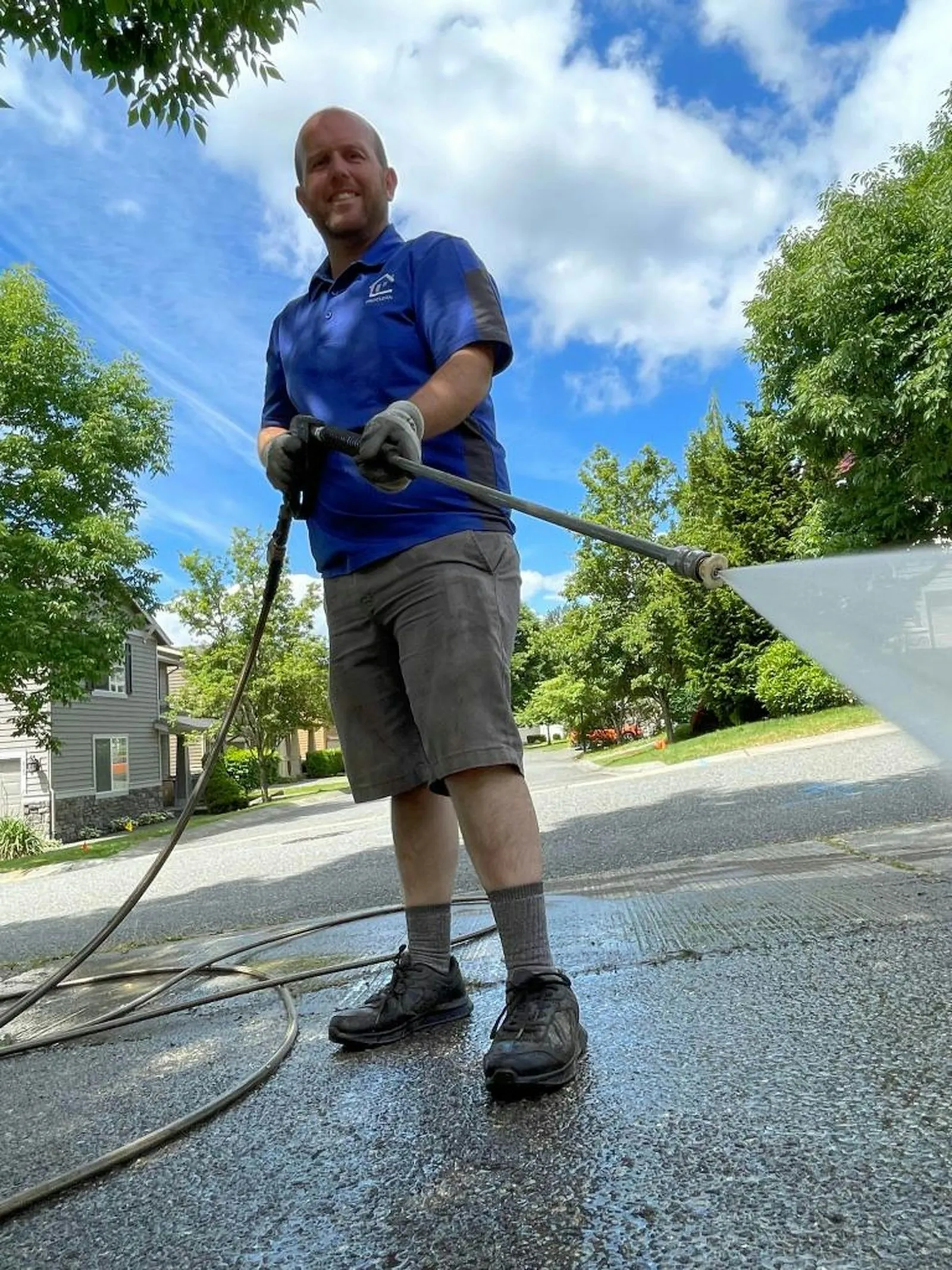 Professional driveway cleaning with pressure washing equipment