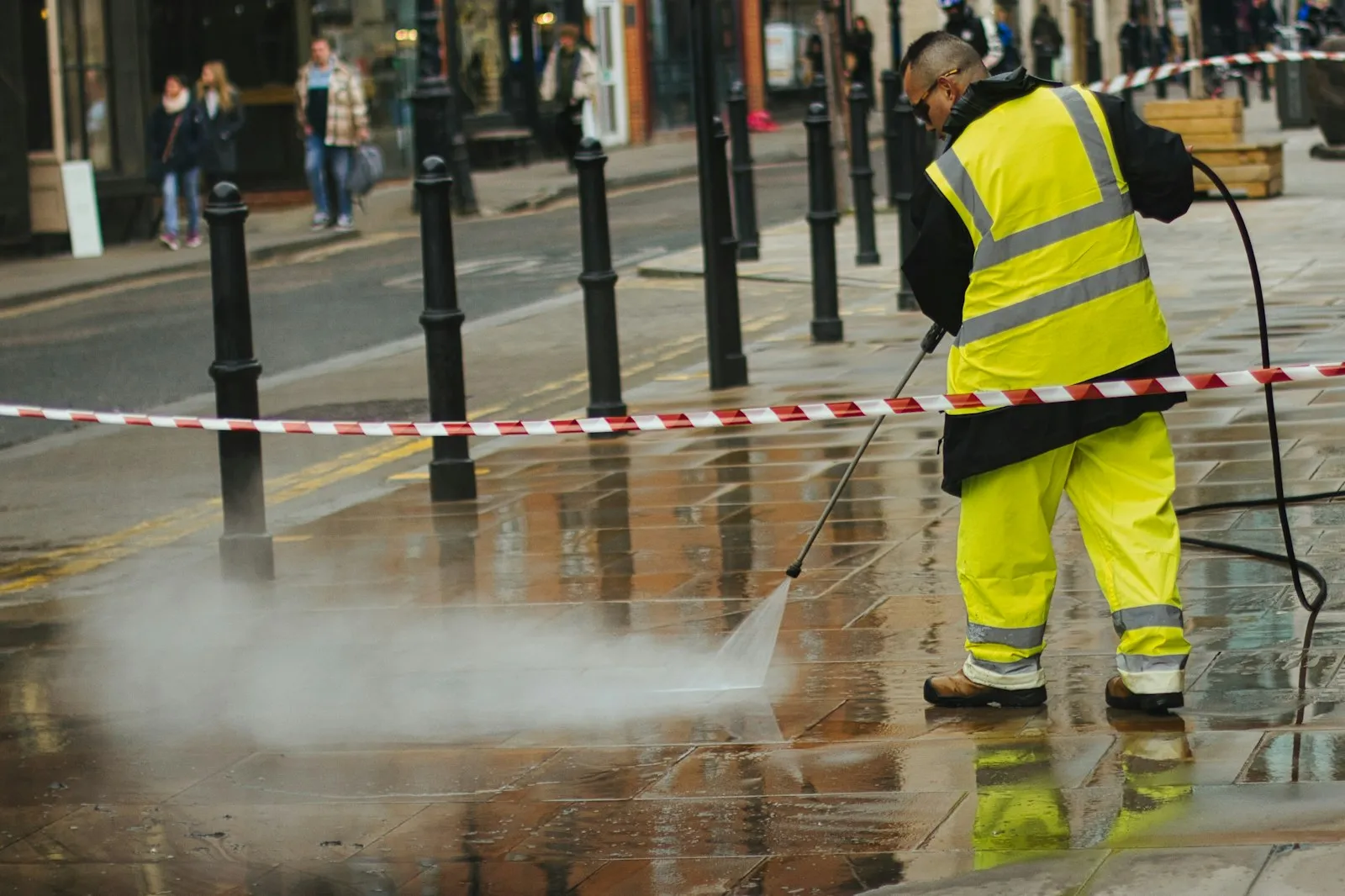 Professional exterior cleaning worker using specialist equipment